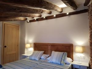 מיטה או מיטות בחדר ב-Can Jaume Porxo
