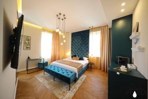 Postel nebo postele na pokoji v ubytování Three Pearls Deluxe Rooms & Studios