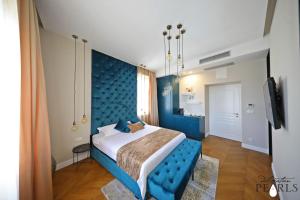Postel nebo postele na pokoji v ubytování Three Pearls Deluxe Rooms & Studios