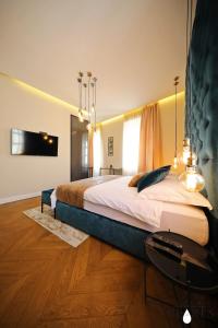 Postel nebo postele na pokoji v ubytování Three Pearls Deluxe Rooms & Studios