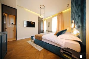 Postel nebo postele na pokoji v ubytování Three Pearls Deluxe Rooms & Studios