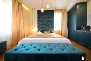 Postel nebo postele na pokoji v ubytování Three Pearls Deluxe Rooms & Studios