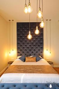 Postel nebo postele na pokoji v ubytování Three Pearls Deluxe Rooms & Studios