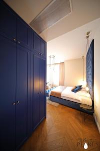 Postel nebo postele na pokoji v ubytování Three Pearls Deluxe Rooms & Studios