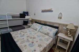 Letto o letti in una camera di B&B Sea and Garden