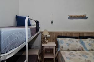 Letto o letti in una camera di B&B Sea and Garden