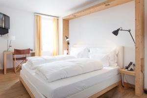 Postel nebo postele na pokoji v ubytování Hotel Müller - mountain lodge
