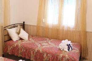 A bed or beds in a room at Polianthi Seaside House