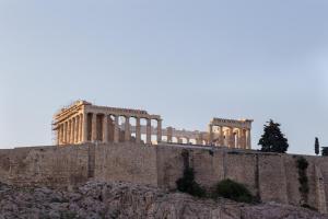 a building on top of a stone wall at Acropolis Stylish Suite in Athens