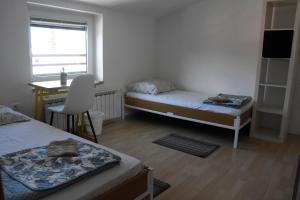 Postel nebo postele na pokoji v ubytování Rooms Busija
