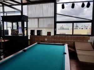 a pool table in a room with a bar at Loft Maria in Tlazcalancingo