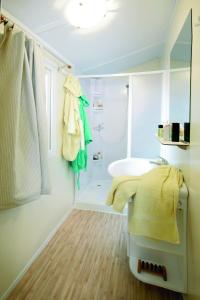 Ein Bett oder Betten in einem Zimmer der Unterkunft New Camping Le Tamerici