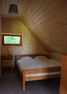 Postel nebo postele na pokoji v ubytování Ubytování Ranč Malenice