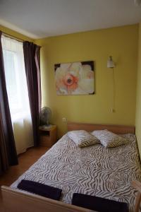 Postel nebo postele na pokoji v ubytování Guesthouse Bērzi