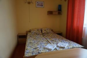Uma cama ou camas num quarto em Guesthouse Bērzi