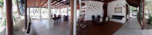 two images of a building with a table and chairs at Deep Blue in Matara