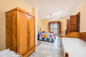 Łóżko lub łóżka w pokoju w obiekcie La torre Casa rural
