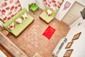 an overhead view of a living room with two chairs and a table at Borgo S.Maria Di Vulci in Montalto di Castro