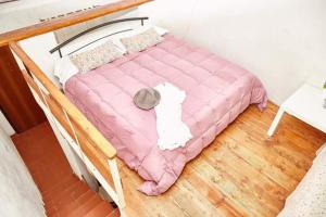 سرير أو أسرّة في غرفة في Borgo S.Maria Di Vulci
