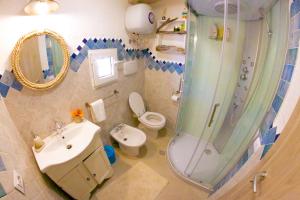 Ванна кімната в Capo Testa Vista Mare