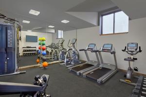 a gym with several treadmills and cardio machines at Scholar Morgantown, Tapestry Collection by Hilton in Morgantown