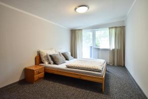 Posteľ alebo postele v izbe v ubytovaní Apartament Na Górskiej