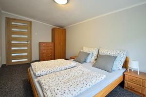 Posteľ alebo postele v izbe v ubytovaní Apartament Na Górskiej