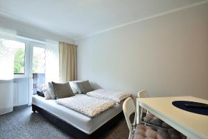 Posteľ alebo postele v izbe v ubytovaní Apartament Na Górskiej