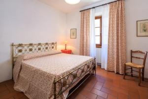 Postel nebo postele na pokoji v ubytování Agriturismo Fattoria di Sommaia