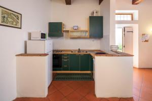 Kuchyň nebo kuchyňský kout v ubytování Agriturismo Fattoria di Sommaia
