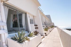 a row ofiterraneaniterraneaniterraneaniterraneaniterranean house plans balcony with plants at Luxury Penthouse in Naturiste; FKK, Nudist Village in Cap d'Agde