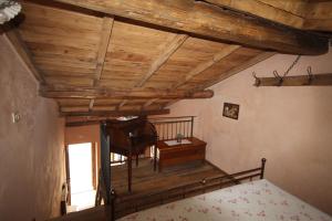 a bedroom with a bed and a table and a desk at b&b casamia in Molina +4 photos