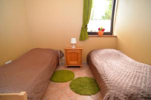 Postel nebo postele na pokoji v ubytování Apartament Poddąbie