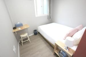 Postel nebo postele na pokoji v ubytování HAH Guesthouse