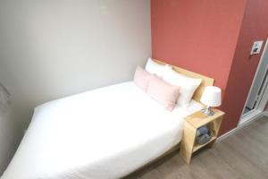 Postel nebo postele na pokoji v ubytování HAH Guesthouse