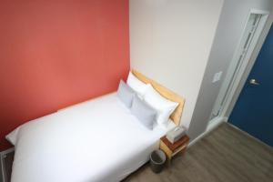 Postel nebo postele na pokoji v ubytování HAH Guesthouse