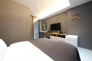 Postel nebo postele na pokoji v ubytování Hotel K