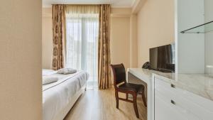 TV a/nebo společenská místnost v ubytování Lisi Hills Hotel