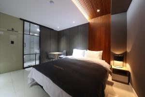 Postel nebo postele na pokoji v ubytování Hotel K