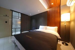 Postel nebo postele na pokoji v ubytování Hotel K