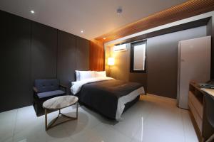 Postel nebo postele na pokoji v ubytování Hotel K