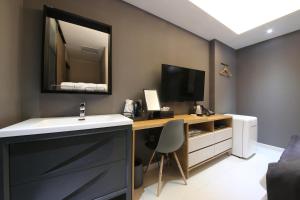 TV a/nebo společenská místnost v ubytování Hotel K