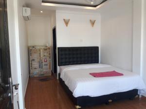 Postel nebo postele na pokoji v ubytování Edo Homestay & Restaurant
