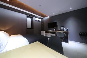 Postel nebo postele na pokoji v ubytování Hotel K