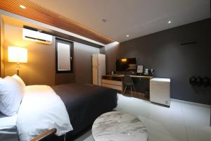 Postel nebo postele na pokoji v ubytování Hotel K