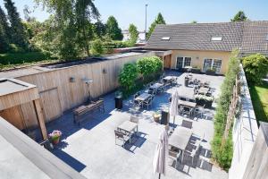 an overhead view of a patio with tables and chairs at Hotel Royal Astrid in Aalst