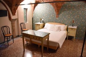 Postel nebo postele na pokoji v ubytování Ca' Monteggia Guest House
