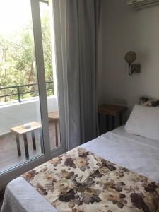 Postel nebo postele na pokoji v ubytování Pataros Hotel