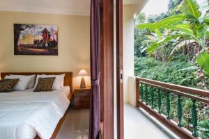 Postel nebo postele na pokoji v ubytování Alam Pangkung Ubud + 37 fotografií