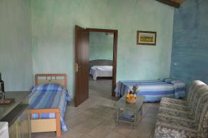 Postel nebo postele na pokoji v ubytování Agriturismo Rubinu